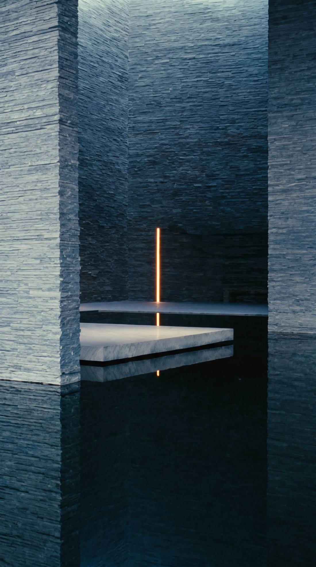 A dark stone bathhouse, still water and a single vertical light.